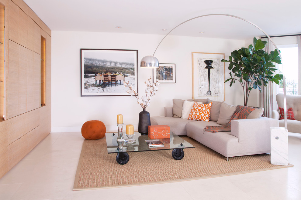 This is an example of a contemporary family room in San Francisco with white walls and no fireplace.
