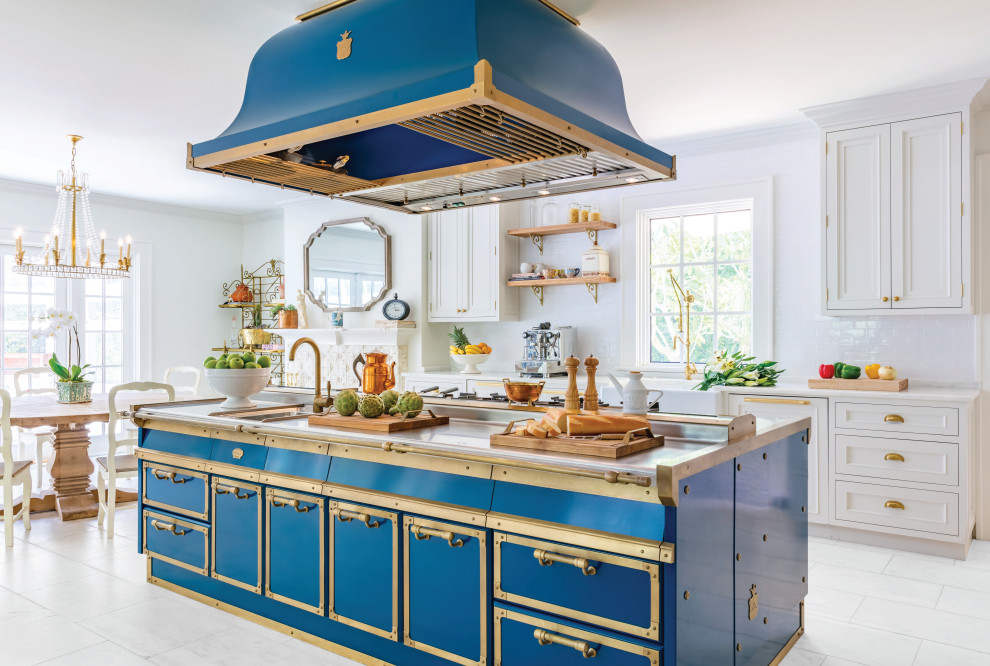 Design ideas for a traditional eat-in kitchen in New York with an integrated sink, stainless steel cabinets, stainless steel benchtops, blue splashback and blue benchtop.