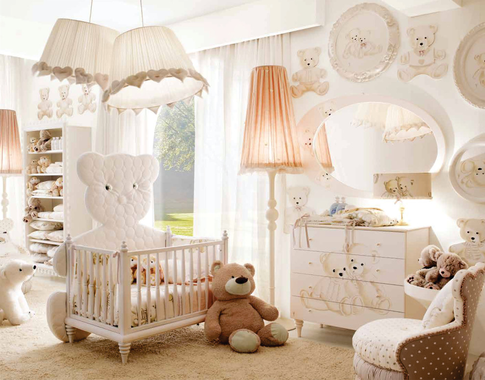 This is an example of a large modern nursery for boys in London with white walls and carpet.