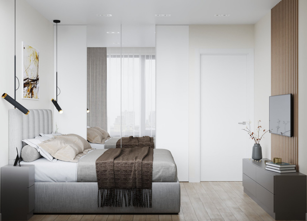 Photo of a small scandinavian master bedroom in London with white walls.