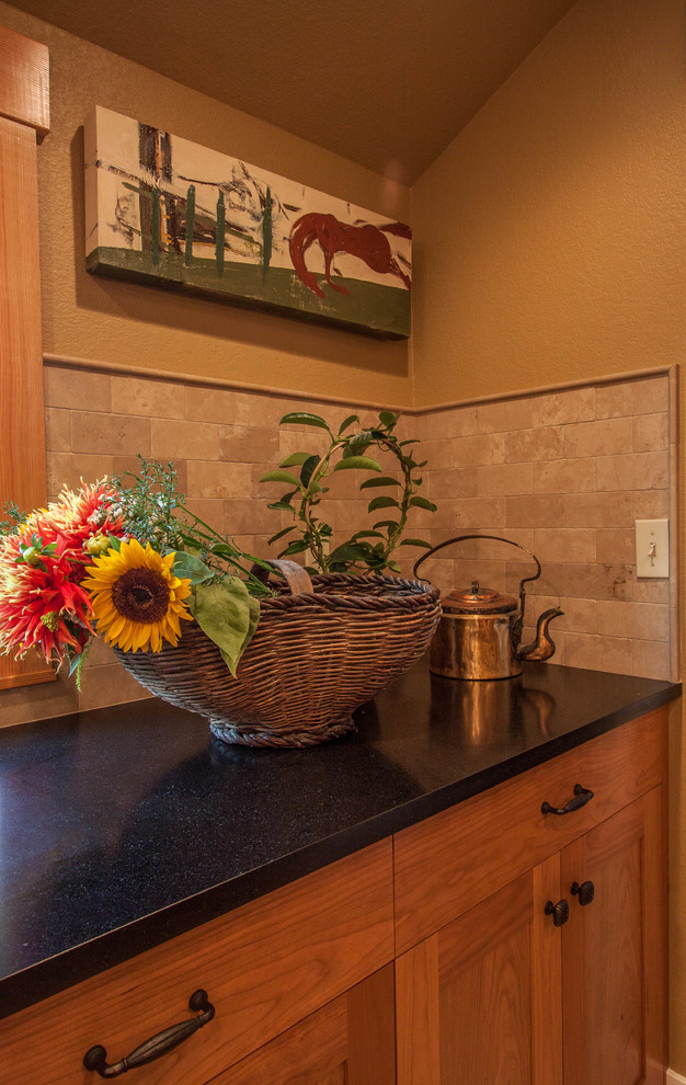 Large transitional porcelain tile and beige floor open concept kitchen photo in Seattle with an undermount sink, shaker cabinets, medium tone wood cabinets, solid surface countertops, beige backsplash, stone tile backsplash, stainless steel appliances and an island