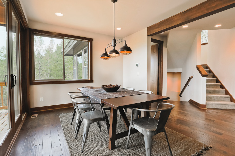 Photo of a mid-sized transitional separate dining room in Seattle with dark hardwood floors.