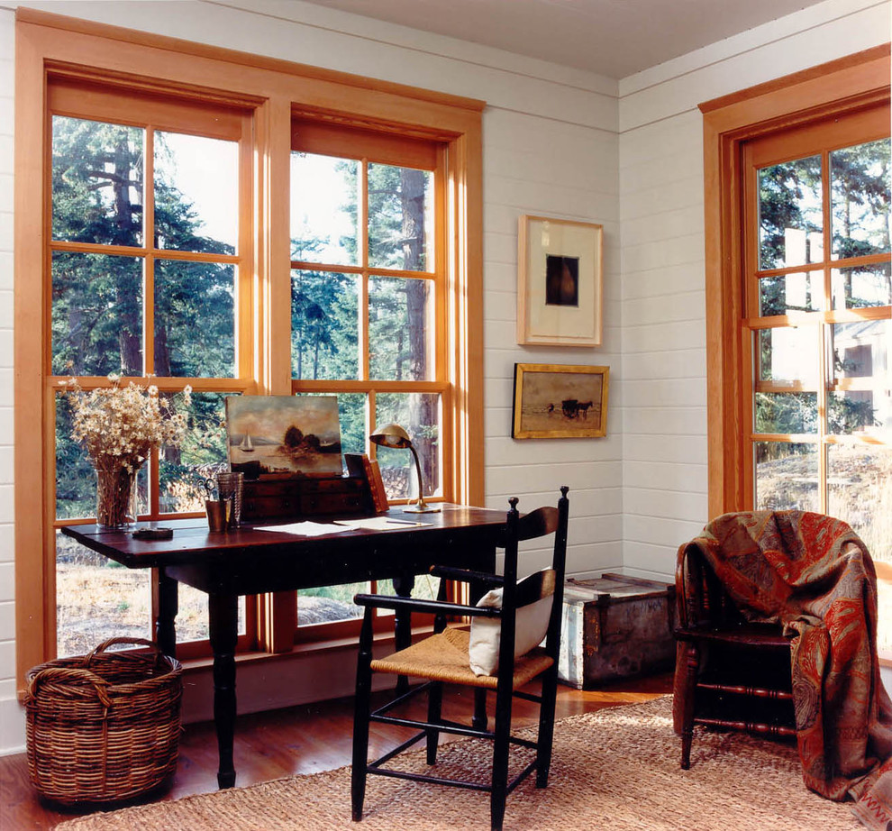 Inspiration for a country home office in Seattle with white walls, medium hardwood floors and a freestanding desk.