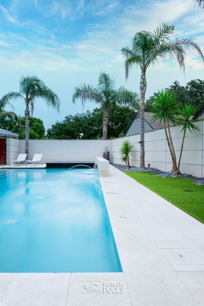 Photo of a contemporary backyard custom-shaped pool.