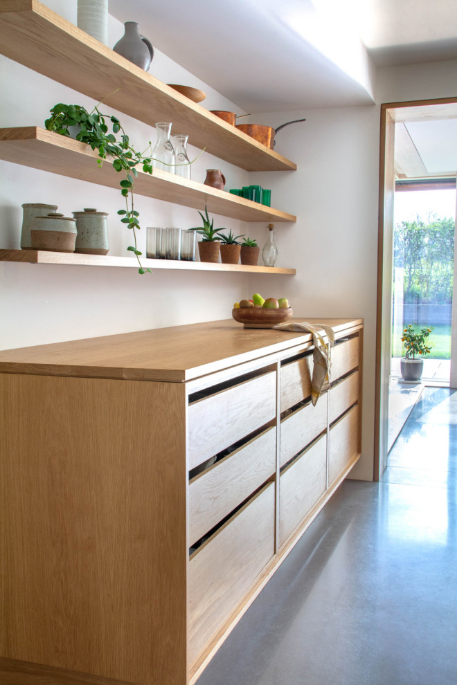 This is an example of a large scandinavian galley open plan kitchen in Other with a double-bowl sink, open cabinets, light wood cabinets, wood benchtops, stainless steel appliances, with island and grey floor.