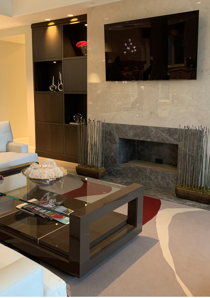 Photo of an expansive contemporary open concept living room in Chicago with a standard fireplace, a stone fireplace surround and a wall-mounted tv.
