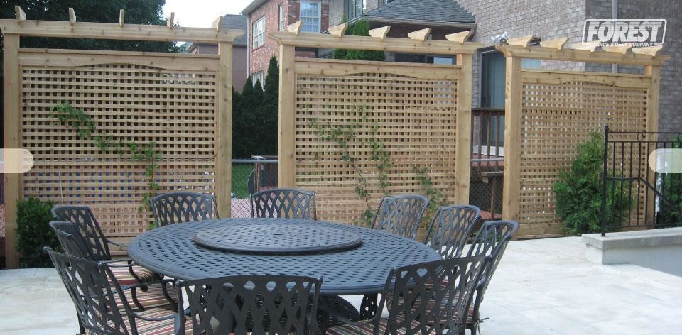 This is an example of a mid-sized backyard patio in Toronto with a pergola.