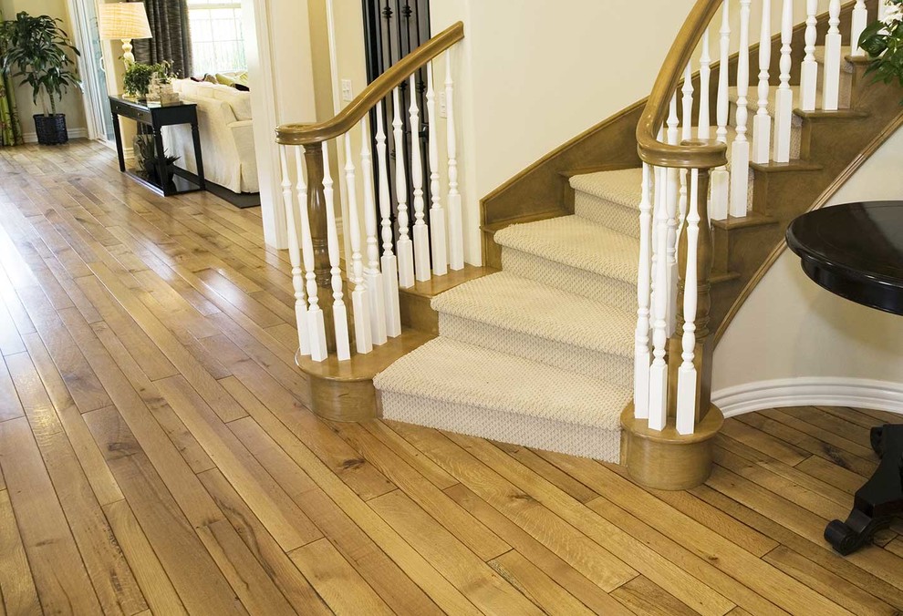 Inspiration for a large traditional wood curved staircase in Oklahoma City with wood risers.