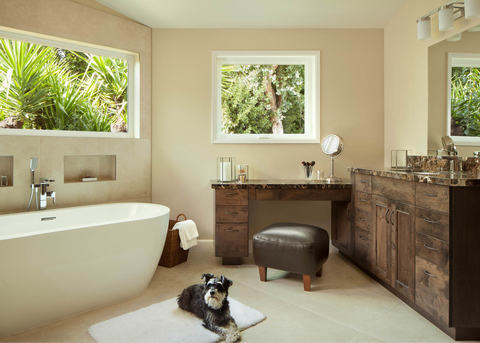Design ideas for a large contemporary master bathroom in San Francisco with flat-panel cabinets, dark wood cabinets, a freestanding tub, an open shower, a two-piece toilet, beige tile, stone tile, beige walls, limestone floors, an undermount sink, granite benchtops, beige floor and an open shower.