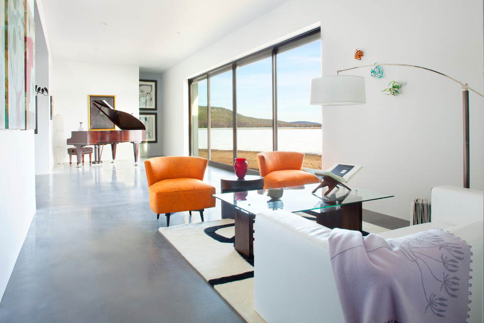 Photo of a contemporary living room in Other with a music area and white walls.