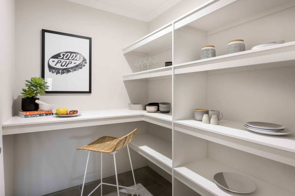 This is an example of a mid-sized contemporary galley kitchen pantry in Perth with open cabinets, white cabinets, quartz benchtops, ceramic floors and grey floor.