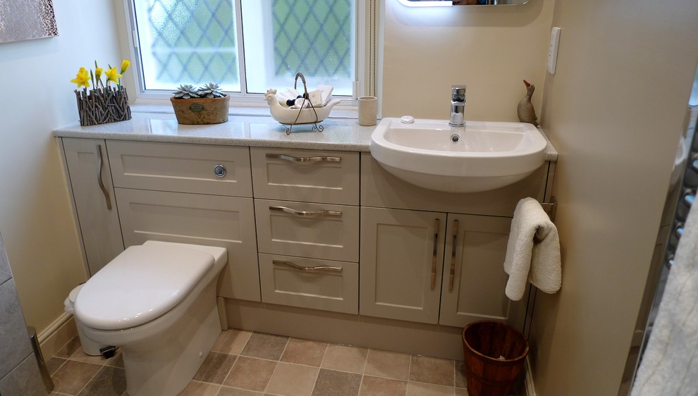 This is an example of a mid-sized modern master bathroom in Oxfordshire with shaker cabinets, an open shower, gray tile, ceramic tile, linoleum floors, laminate benchtops and an open shower.