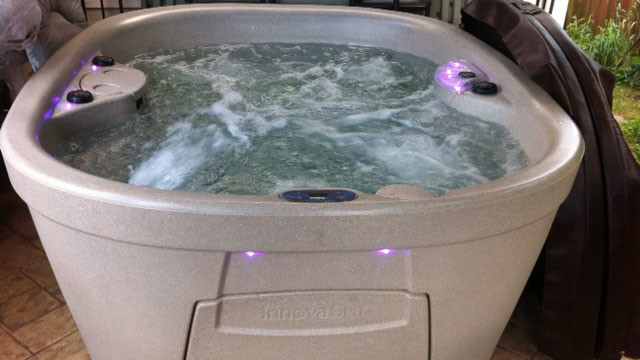 Example of a backyard tile aboveground hot tub design
