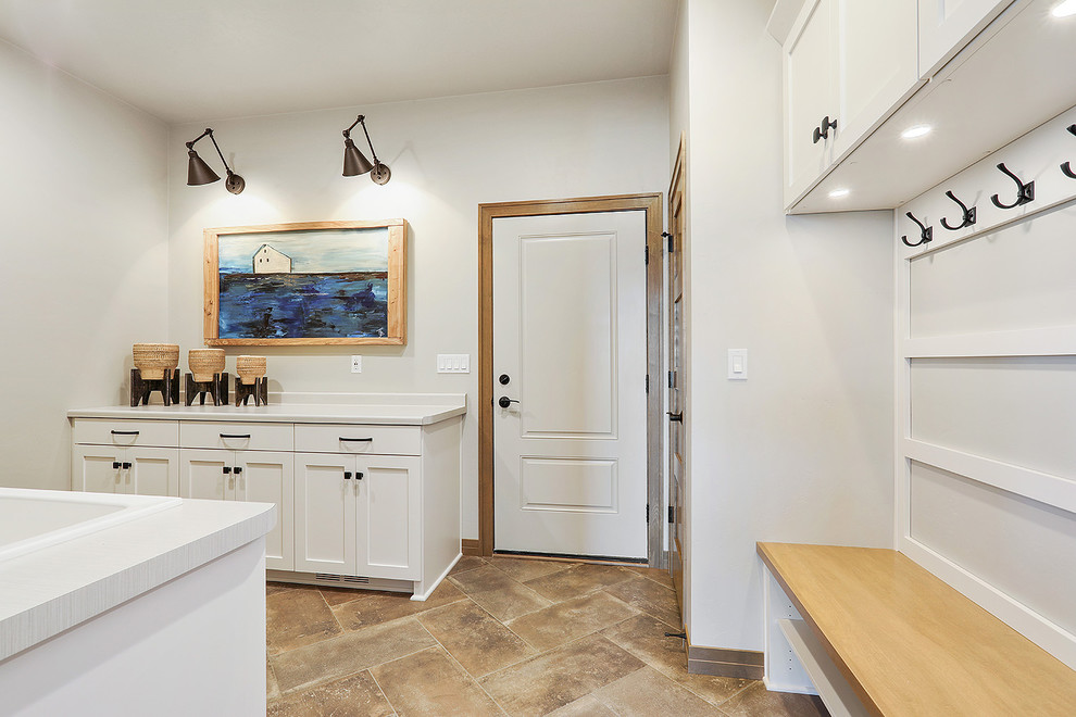This is an example of a mid-sized eclectic mudroom in Other with grey walls, ceramic floors, a single front door, a white front door and orange floor.