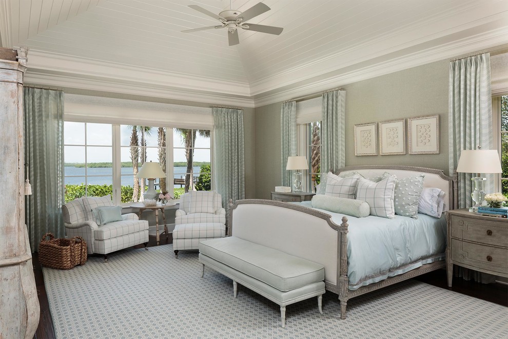 Inspiration for a beach style master bedroom in Miami with grey walls, dark hardwood floors and no fireplace.