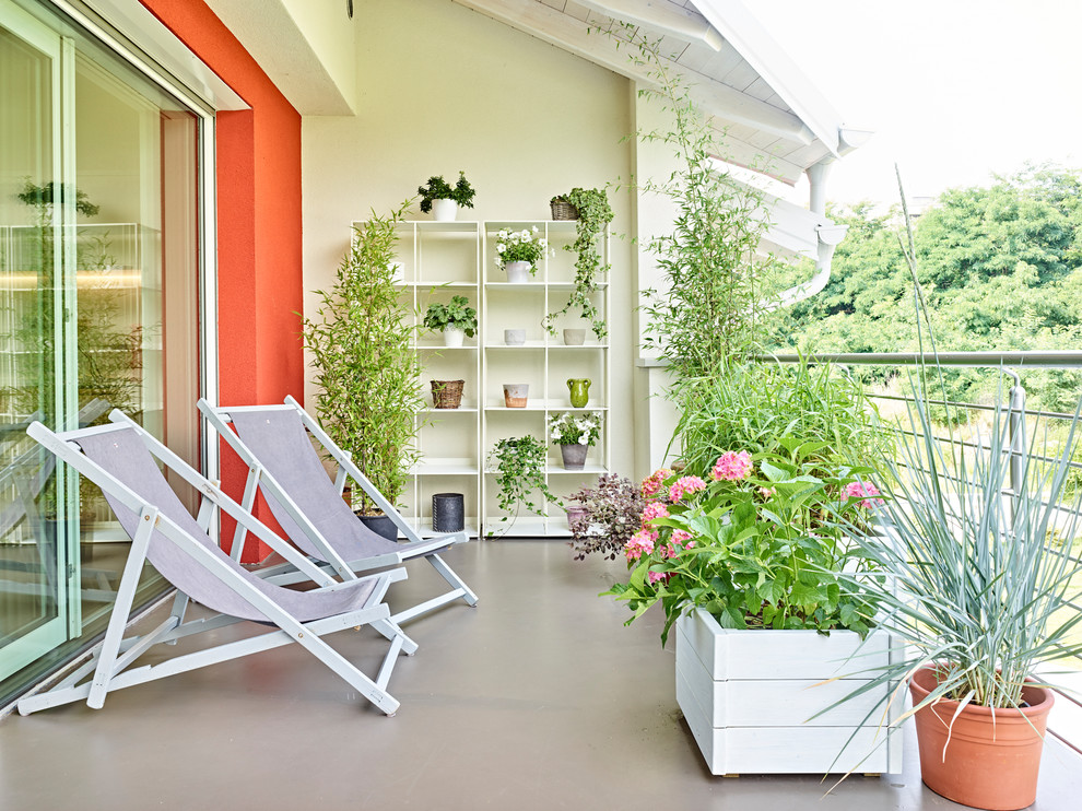 Design ideas for a mid-sized country balcony in Other with a roof extension, metal railing and a container garden.