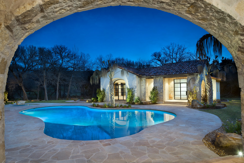 Mountain style pool photo in Austin