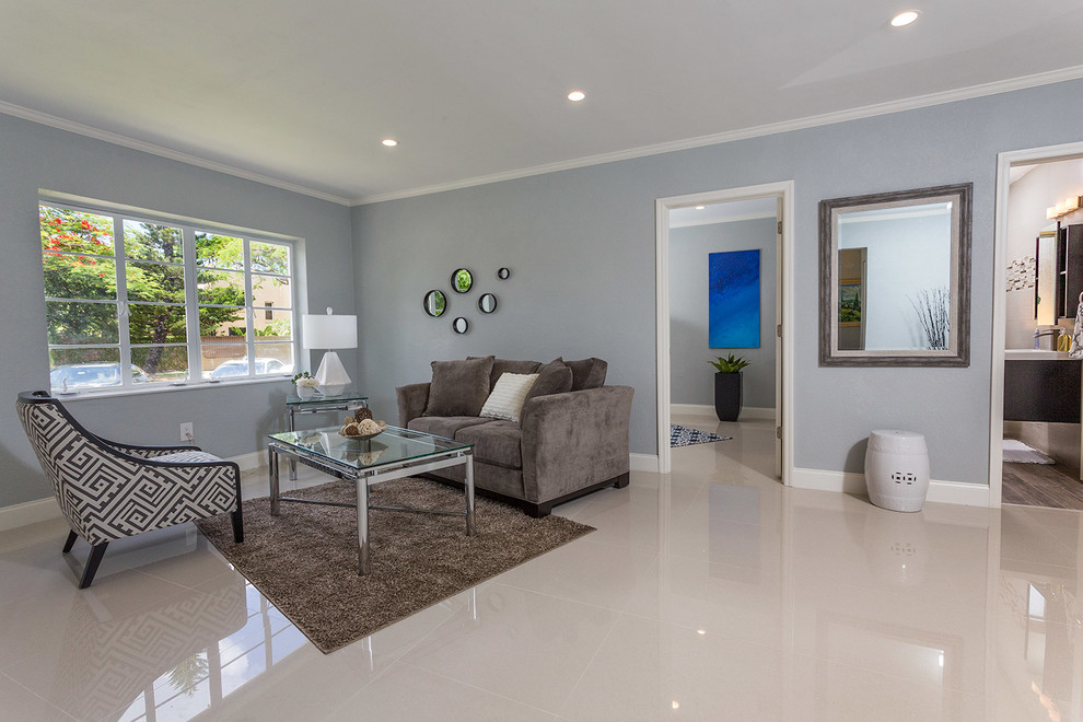 Photo of a mid-sized contemporary formal open concept living room in Miami with blue walls, linoleum floors, no fireplace, no tv and white floor.