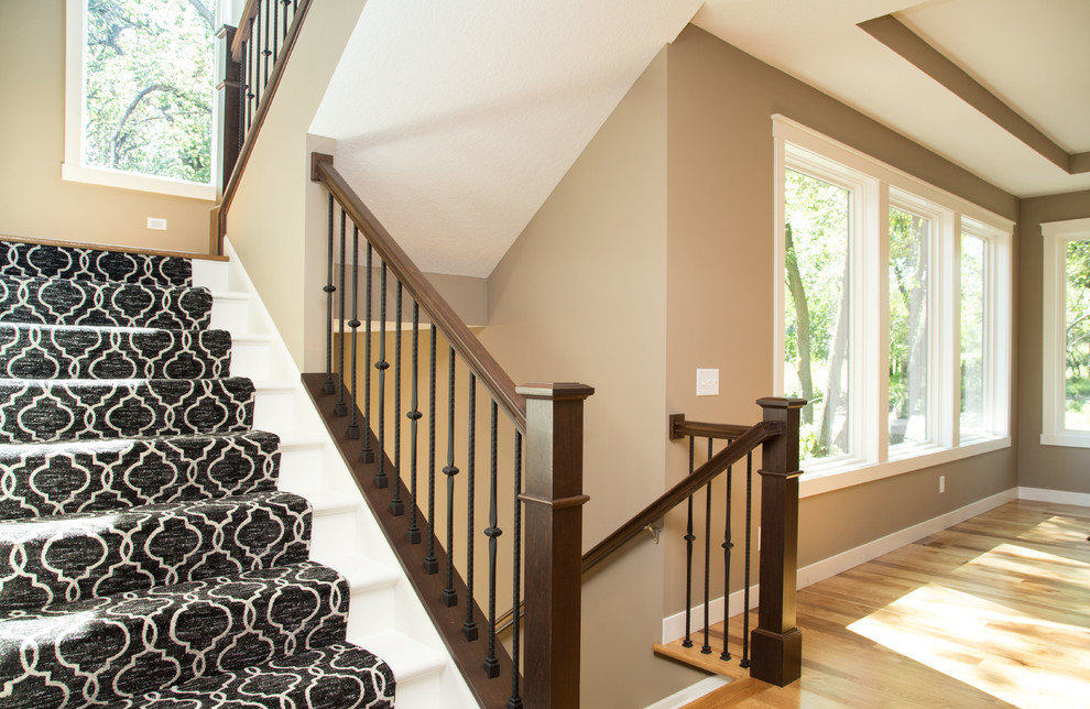 Transitional carpeted u-shaped staircase photo in Minneapolis with painted risers