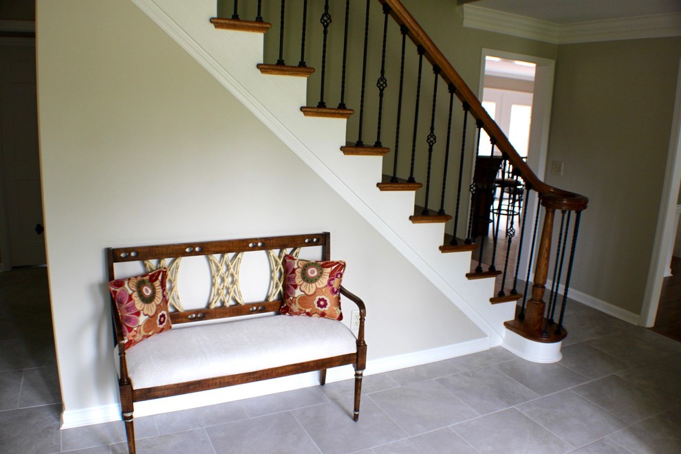 Mid-sized transitional porcelain tile and gray floor foyer photo in Cincinnati with gray walls