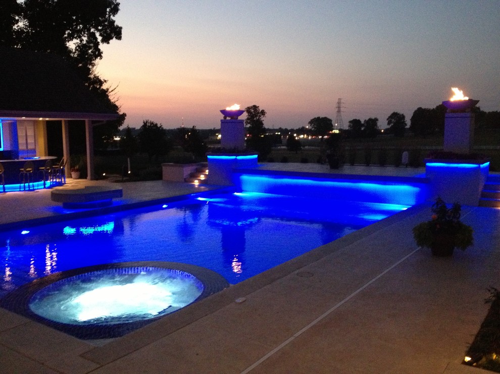 Large transitional backyard concrete paver and rectangular natural hot tub photo in Cedar Rapids
