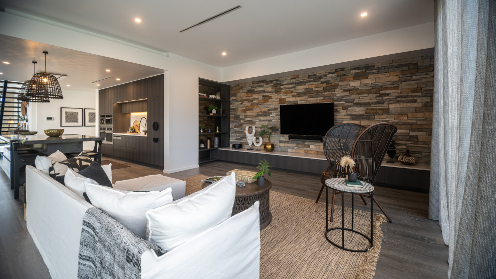 This is an example of a mid-sized contemporary open concept living room in Gold Coast - Tweed with white walls, dark hardwood floors, a wall-mounted tv and brown floor.