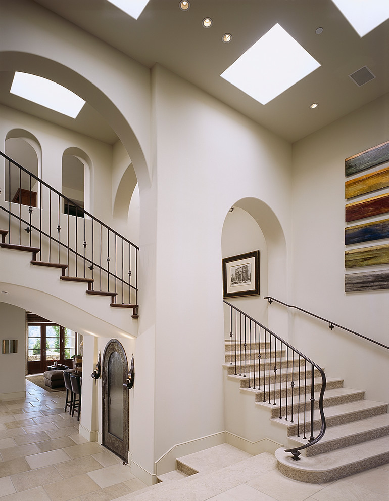 This is an example of a mediterranean curved staircase in Los Angeles.