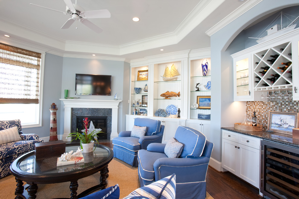 Large traditional open concept living room in Houston with blue walls, dark hardwood floors, a wall-mounted tv, a home bar, a tile fireplace surround and a corner fireplace.