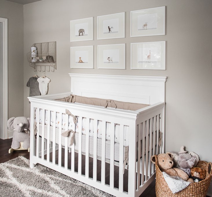 Mid-sized transitional gender-neutral nursery in Toronto with grey walls and dark hardwood floors.