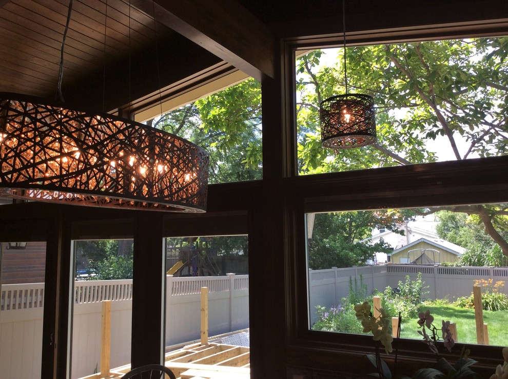 Inspiration for a rustic eat-in kitchen remodel in Chicago with medium tone wood cabinets and a peninsula
