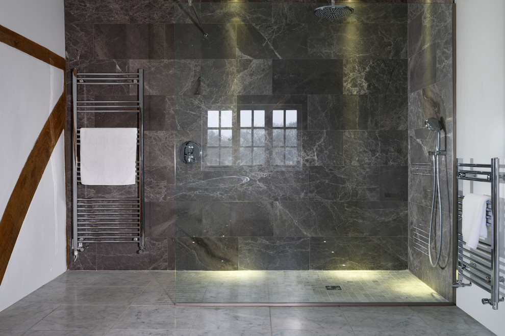 This is an example of a large modern master bathroom in Kent with an open shower, an open shower and gray tile.