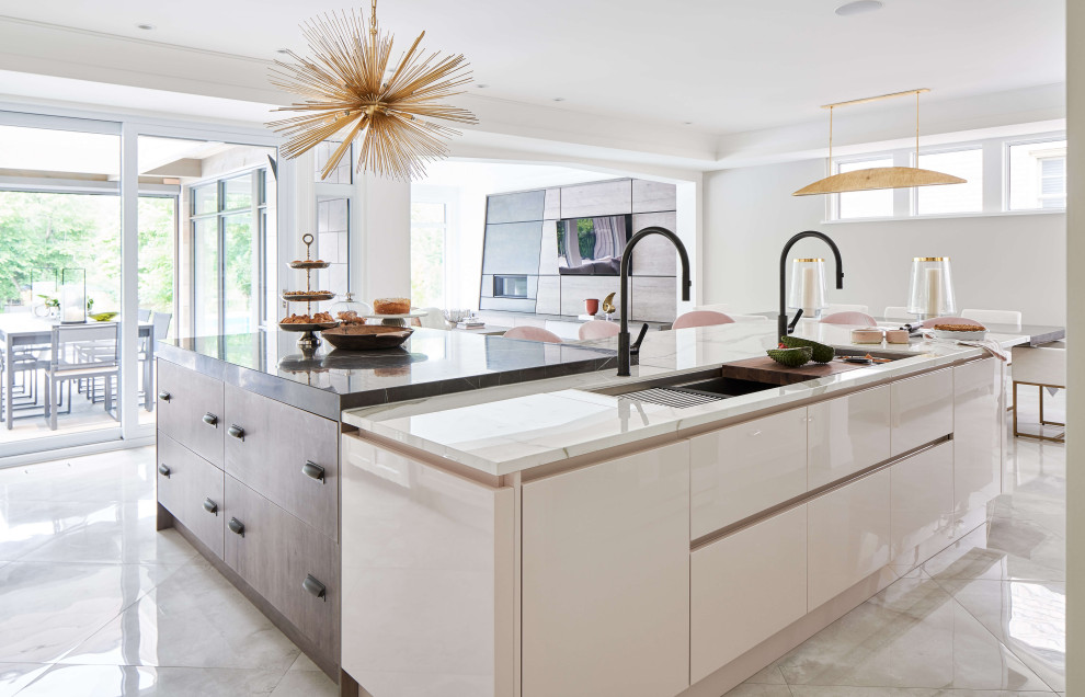 Example of a large trendy l-shaped eat-in kitchen design in Ottawa with two islands
