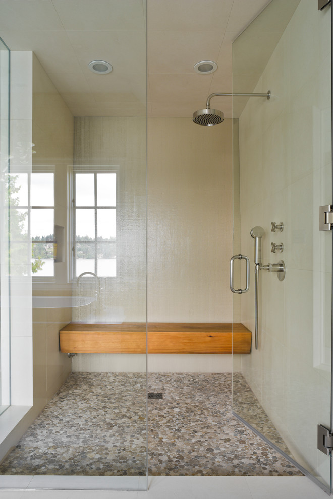Transitional bathroom in New York with mosaic tile and a shower seat.