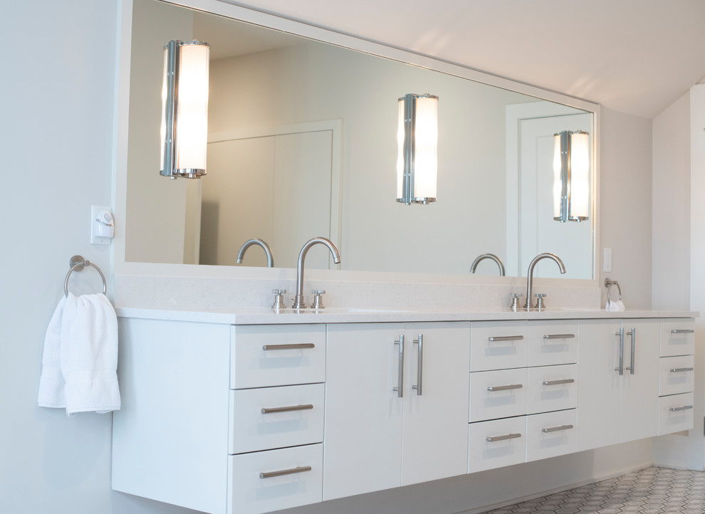 Large transitional master bathroom in Charleston with flat-panel cabinets, white cabinets, a freestanding tub, engineered quartz benchtops, white benchtops, a double vanity, a floating vanity, beige walls, porcelain floors, an undermount sink and multi-coloured floor.