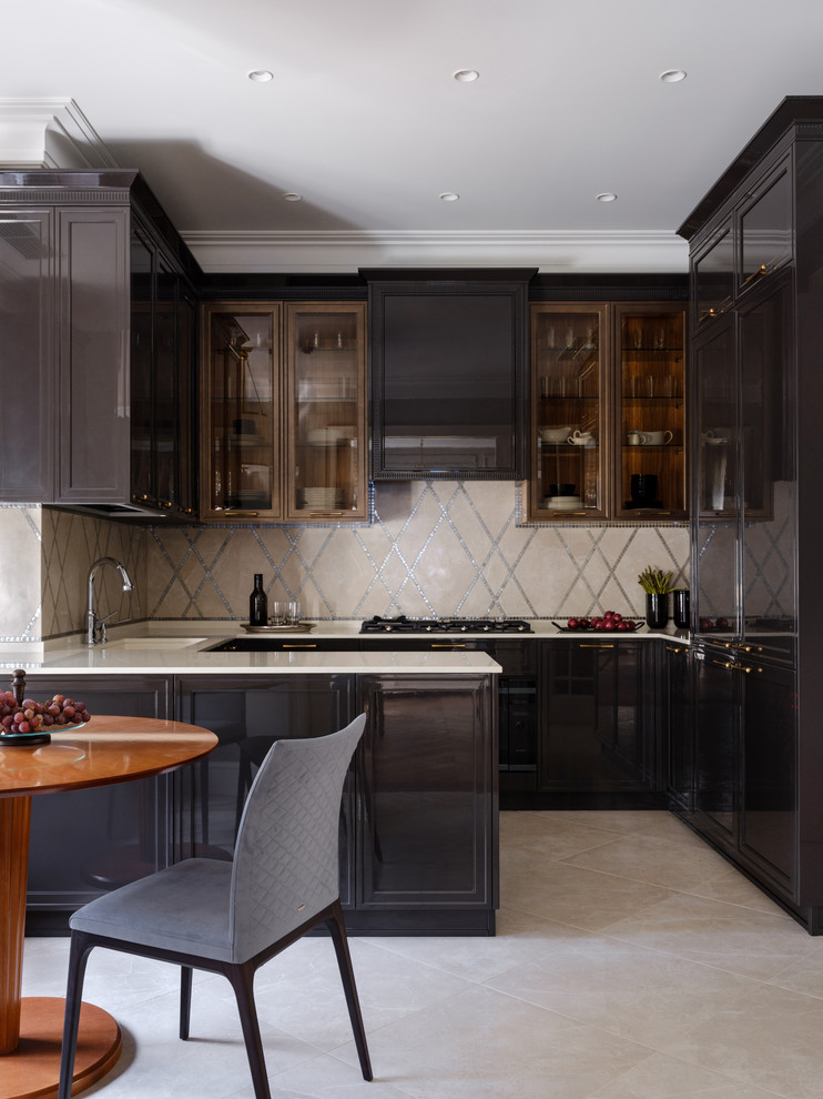 Photo of a transitional u-shaped eat-in kitchen in Moscow with black cabinets, beige splashback, a peninsula and beige floor.