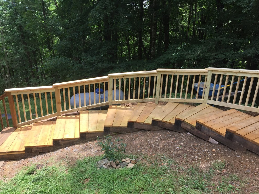 Design ideas for a large rustic shade hillside mulch garden path in Charlotte.