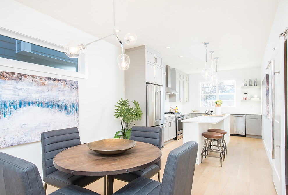 Example of a transitional dining room design in Edmonton