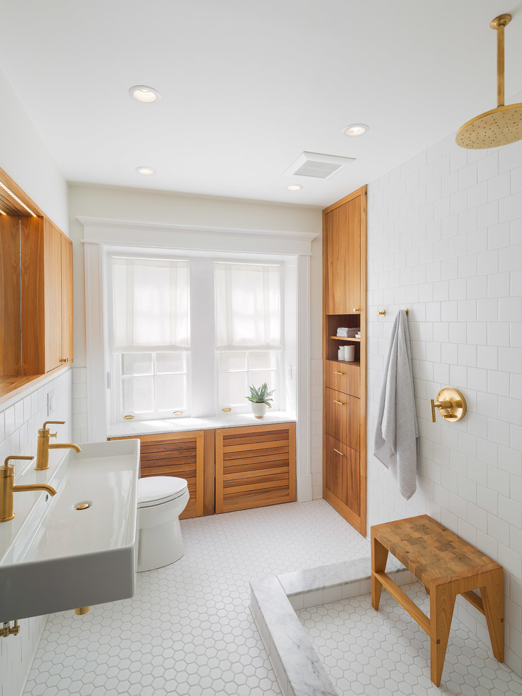 Inspiration for a mid-sized scandinavian bathroom in Philadelphia with a trough sink, flat-panel cabinets, medium wood cabinets, an open shower, white tile, an open shower and white floor.