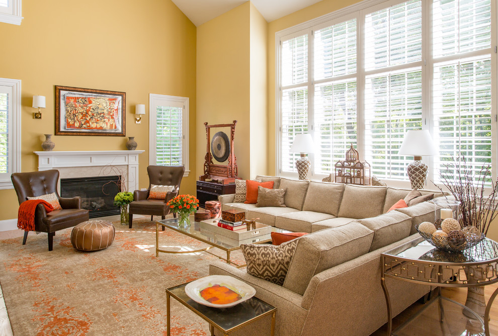 Large traditional open concept living room in Boston with yellow walls, light hardwood floors, a standard fireplace and a tile fireplace surround.