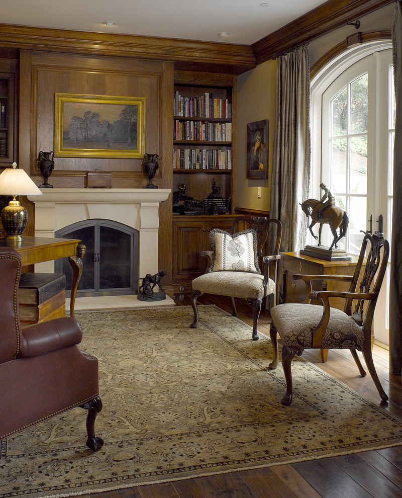 Inspiration for a traditional home office in San Francisco with dark hardwood floors and a standard fireplace.
