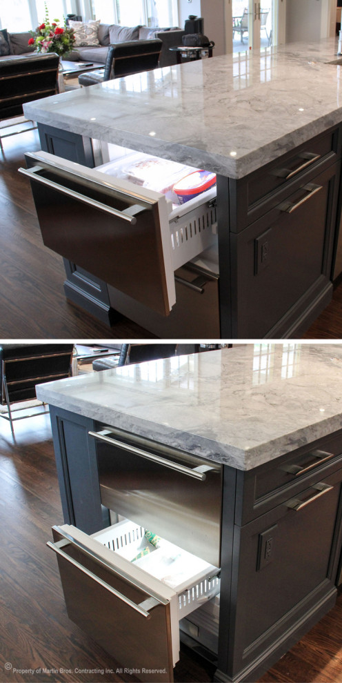 Open concept kitchen - large transitional single-wall medium tone wood floor open concept kitchen idea with a double-bowl sink, recessed-panel cabinets, gray cabinets, marble countertops, multicolored backsplash, stainless steel appliances, an island and marble backsplash
