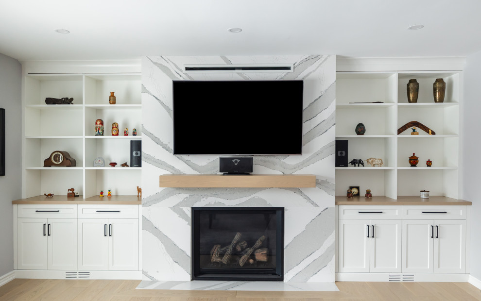Open concept kitchen - mid-sized transitional light wood floor open concept kitchen idea in Toronto with shaker cabinets, white cabinets, quartz countertops, white backsplash, quartz backsplash and white countertops