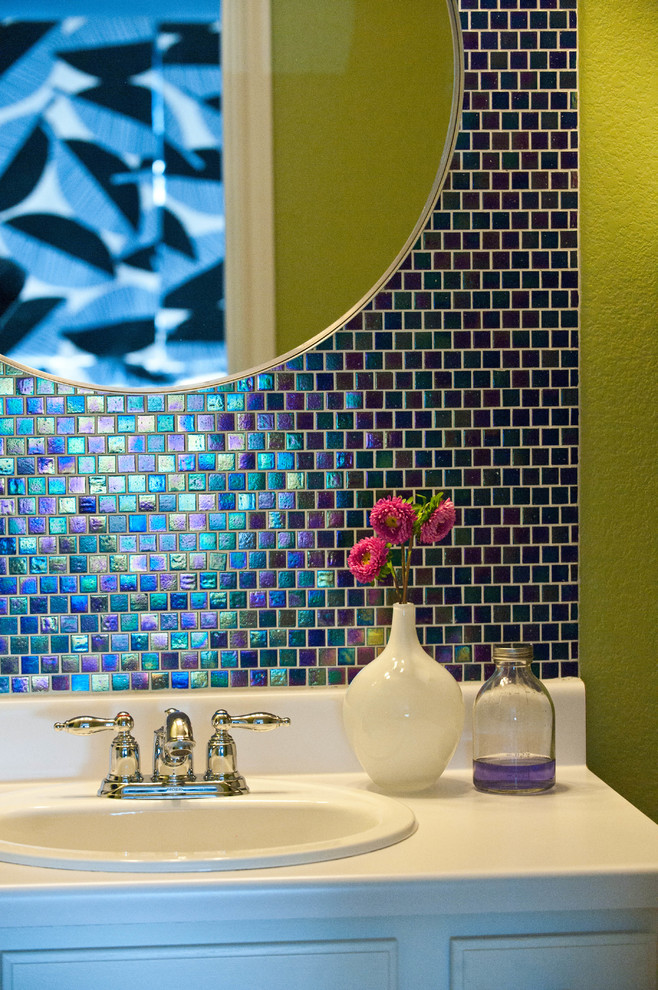 Inspiration for a small modern master bathroom in Austin with a drop-in sink, recessed-panel cabinets, white cabinets, laminate benchtops, an alcove tub, a shower/bathtub combo, a two-piece toilet, blue tile, glass tile, green walls and porcelain floors.