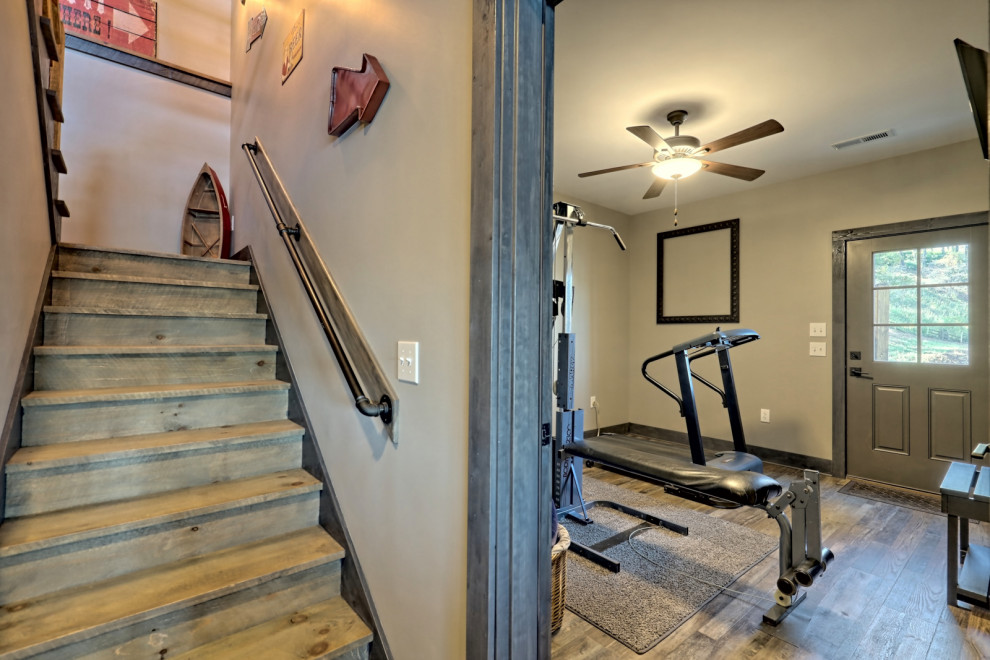 Inspiration for a small arts and crafts home weight room in Atlanta with grey walls, vinyl floors and grey floor.