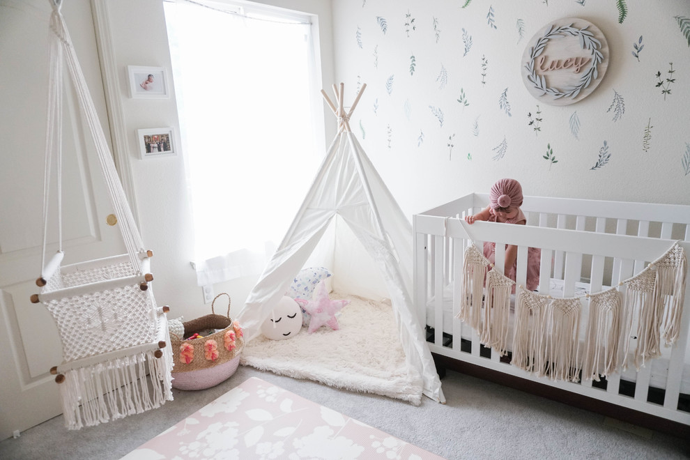 This is an example of a mid-sized traditional nursery for girls in Vancouver with white walls.