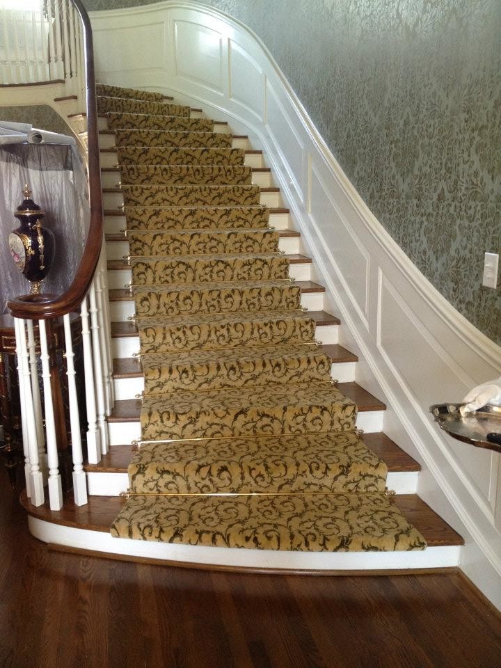 Carpeted straight staircase in Charlotte.