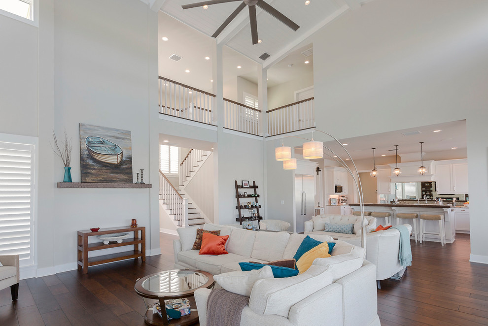 Beach style dining room in Tampa with white walls, dark hardwood flooring, no fireplace, brown floors and a coffered ceiling.