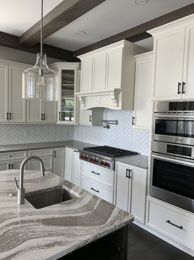 Inspiration for a large transitional l-shaped open plan kitchen in Other with an undermount sink, shaker cabinets, white cabinets, quartz benchtops, white splashback, ceramic splashback, stainless steel appliances, with island and multi-coloured benchtop.