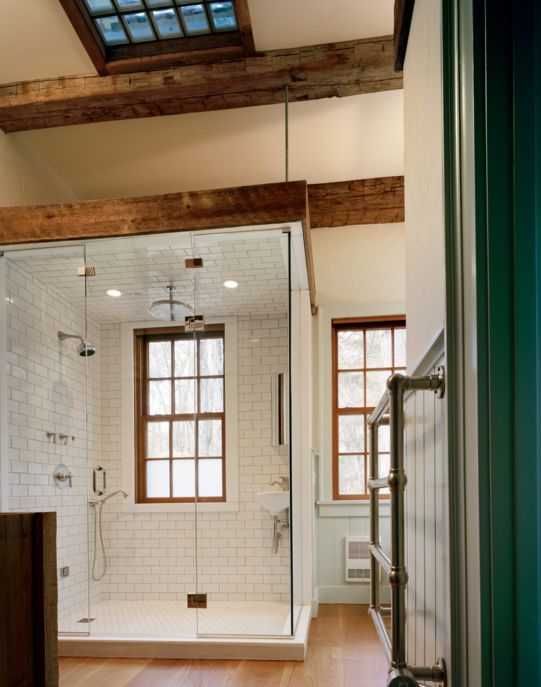 Inspiration for a country bathroom in New York with an alcove shower, white tile and subway tile.