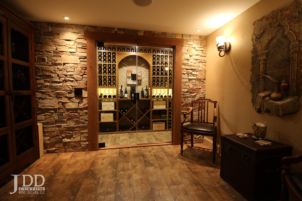 Inspiration for a large traditional wine cellar in Cincinnati with ceramic floors and storage racks.